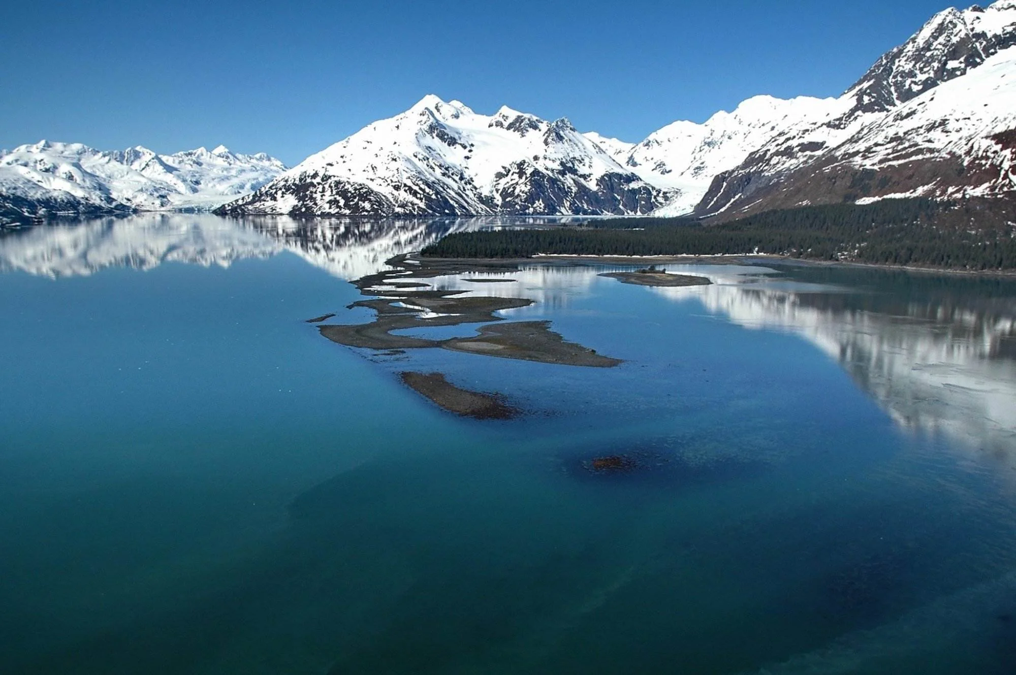 Photo of places to stay in seward, alaska - snowy mountain view with prestine lake view